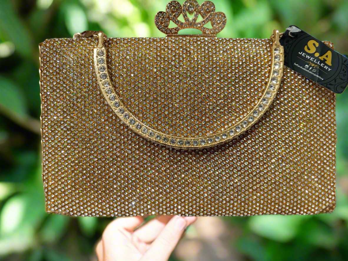 👑 Royal Golden Stone Studded Clutch – Round Stone Handle & Crown Crystal Lock 👑 SAjewellery pk